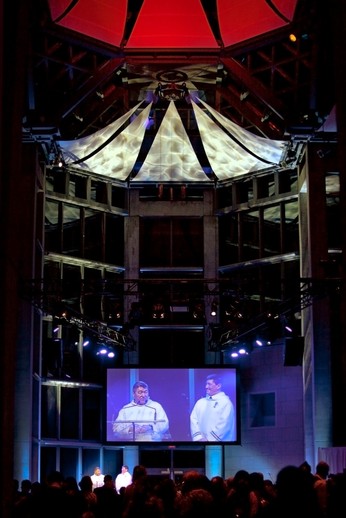 Zebedee Nungak adresses the crowd with Charlie Arngak at his side, in the Grand Hall of the National Gallery of Canada.  