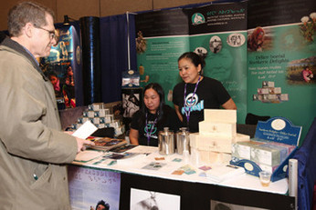 Elisapi Novalinga and Rhoda Kokiapik at the Avataq booth (Photo by Heiko Wittenborn)