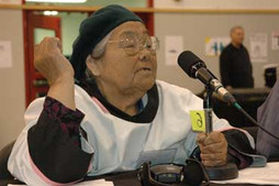 Elder Alacie Tullaugak from Puvirnituq takes the microphone