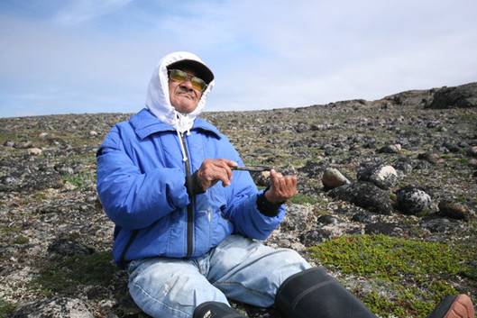 Simon Makimak explaining the use of the tarquti at his birthplace, Cape Smith Island, summer 2010.