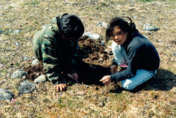 Two Inuit students surveying site IdGo-50